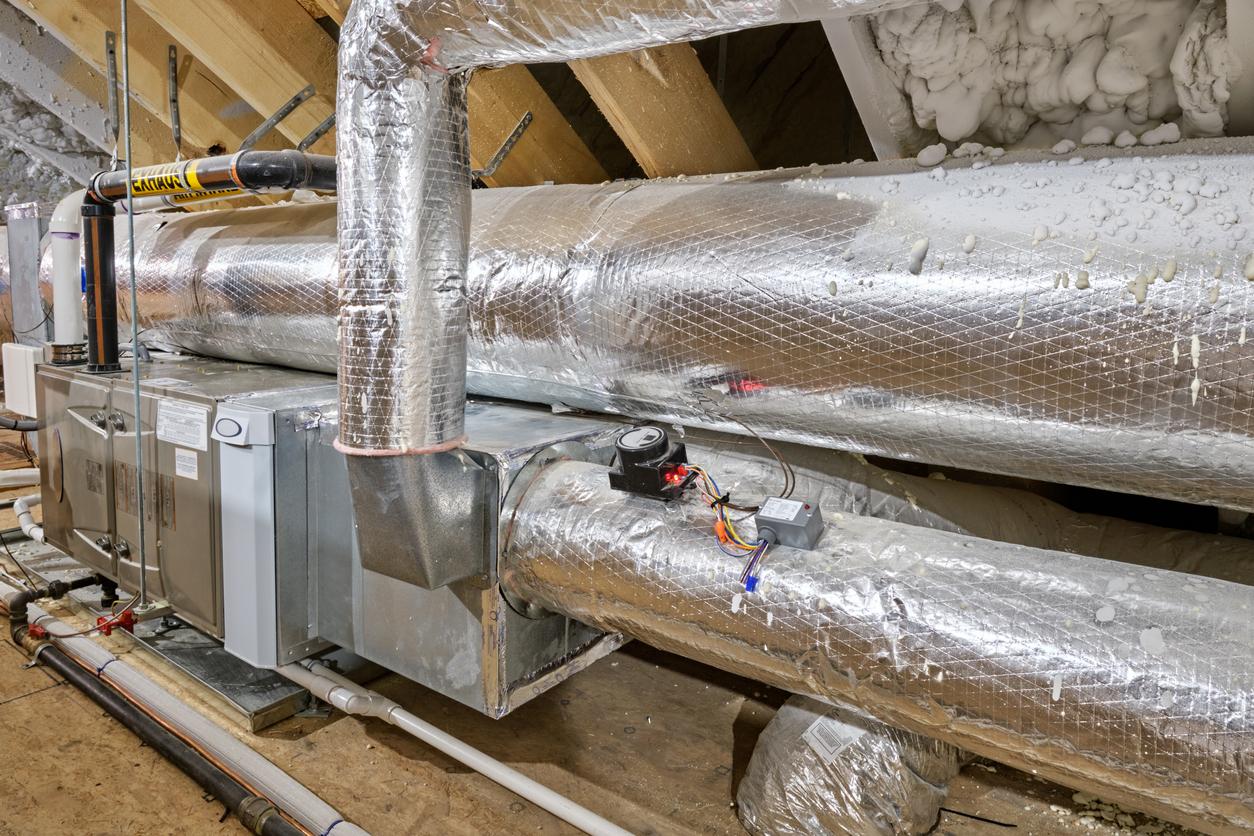 A heating and cooling system in an attic.