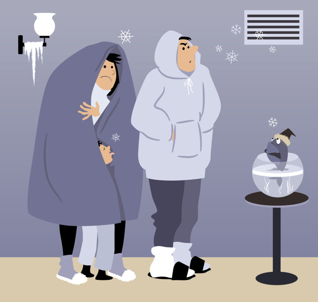 A cartoon of a family freezing at home without central heat.