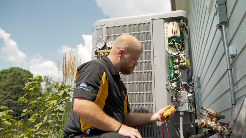 Modern Air Solutions tech working on central AC